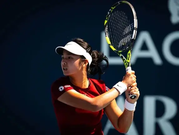 Alexandra Eala turning down a luxury car